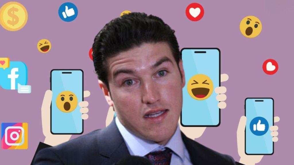 a Man in a Suit is Surrounded by Smartphone Screens Showing Emoji Reactions Amid Floating Social Media Icons on a Purple Background. - Tu Vecino Informa