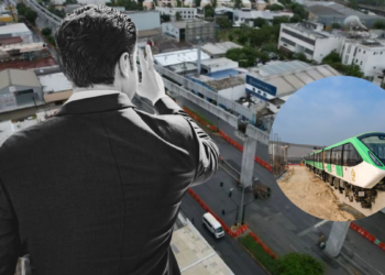 Businessman on a rooftop overlooking a city, with a circular inset showing a green-and-white passenger train on tracks.