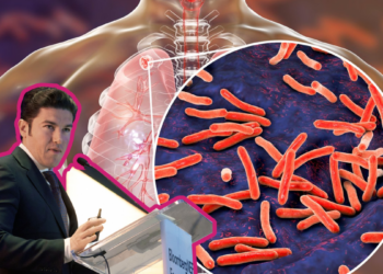 Medical Presenter at a Podium Giving a Talk, with a Large Circular Close-up of Red Rod-shaped Bacteria over a Human Torso Illustration in the Background. - Tu Vecino Informa