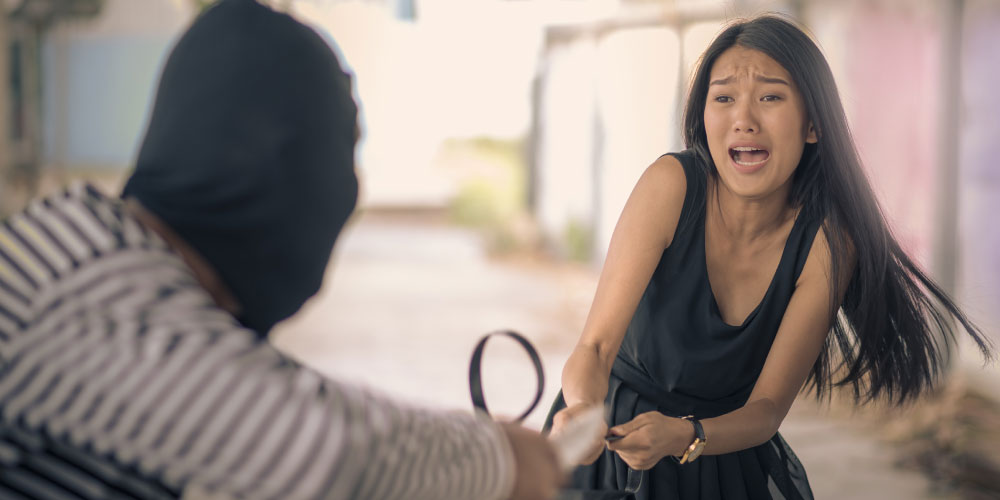 Image - Tu Vecino Informa Woman in a Black Dress Reaches Toward a Wallet As a Masked Robber Grabs It in a Street Robbery Scene - Tu Vecino Informa